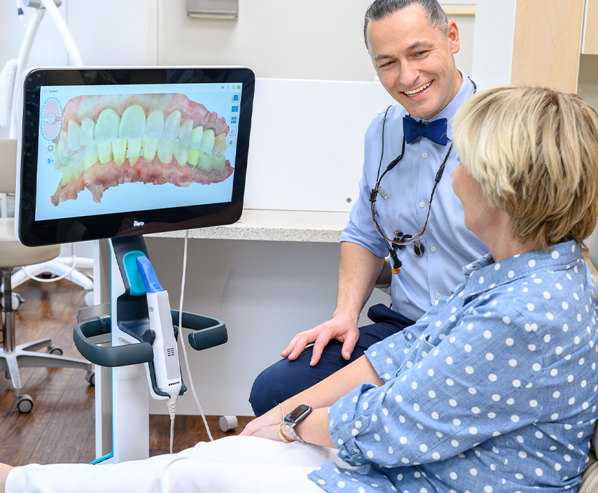 Dentist in South Austin Dr. Yaron Shvets with a patient