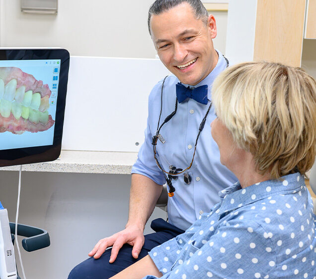 Dr. Yaron Shvets, DDS with a patient Home Page